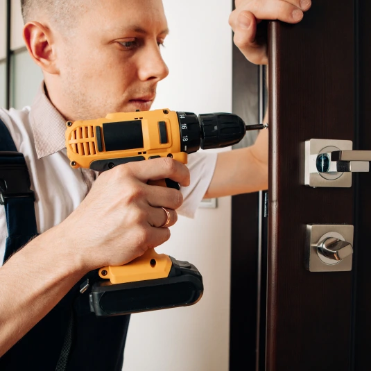handyman blue uniform works with electricity automatic screwdriver house renovation conception